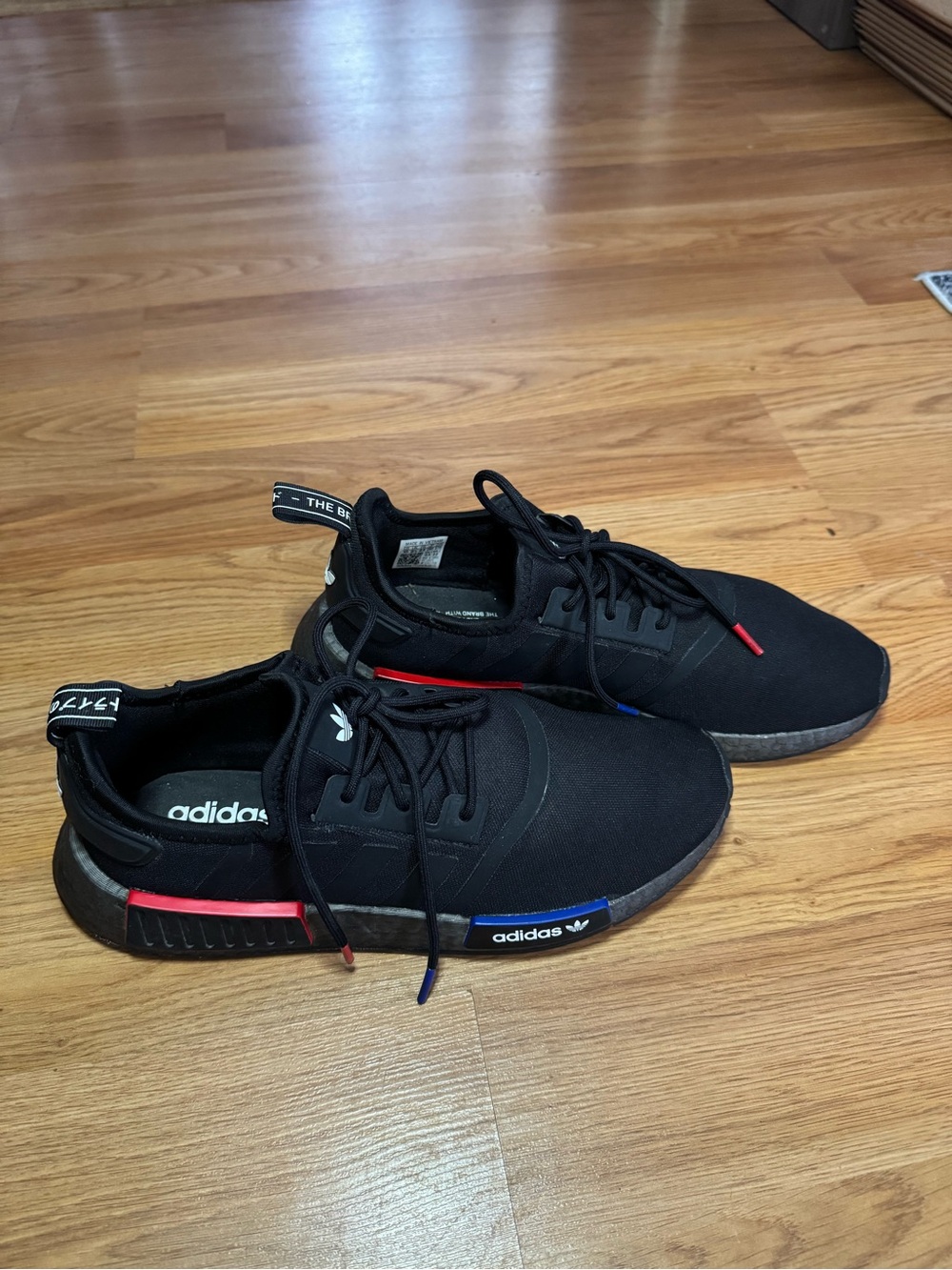 adidas Black Men’s NMD R1 Sneakers with Red & Blue Accent